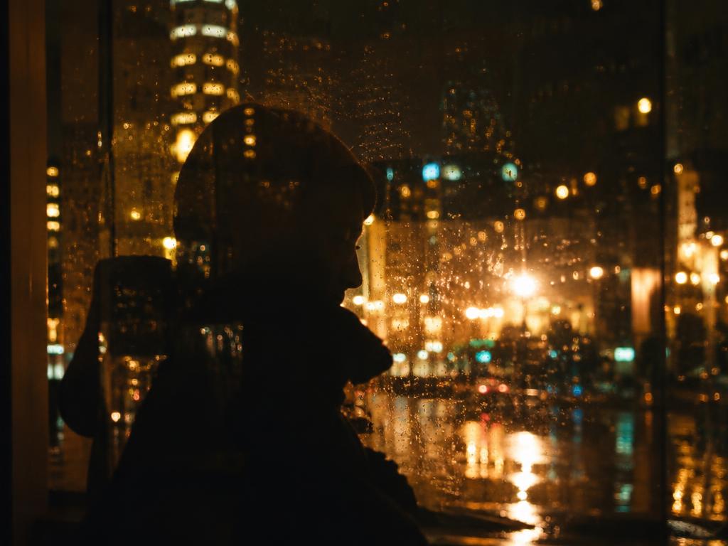 Reflection in a rainy city window